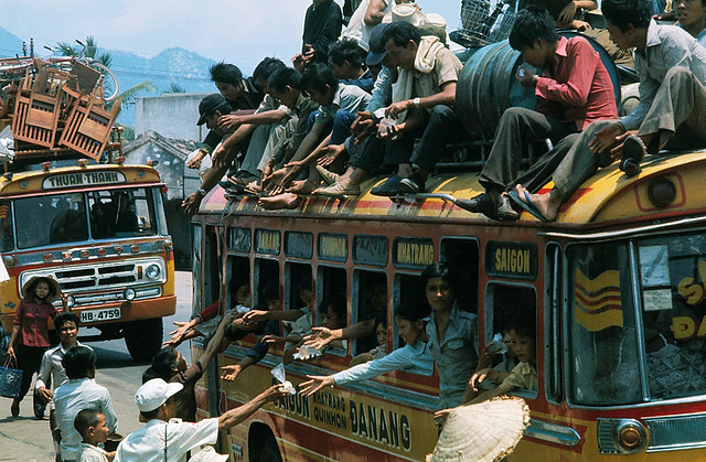 1975 Fall of Saigon - Civilians Offering Food and Drink to Refugees