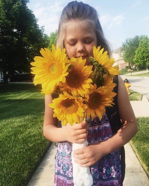 This little peanut turns 8 tomorrow and I'm in denial. . #sunflowers #thisis7
