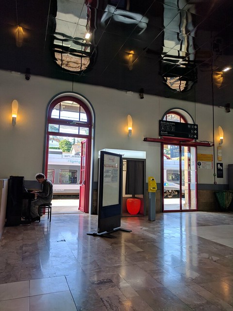 Playing some tunes at the train station in Biarritz, France