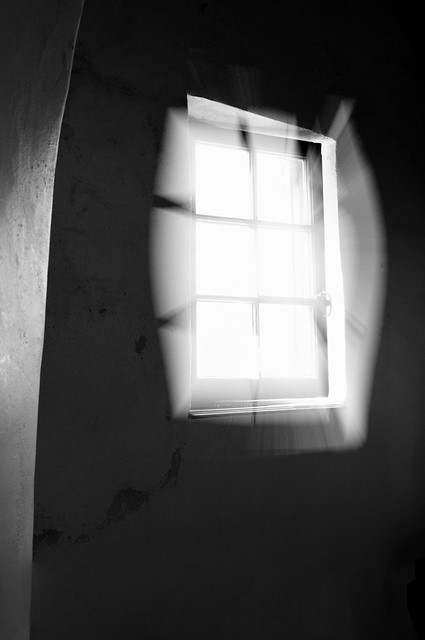 black & white fine art - straining through, glaring summer light into an ancient window at Crathes Castle, Aberdeenshire, Scotland