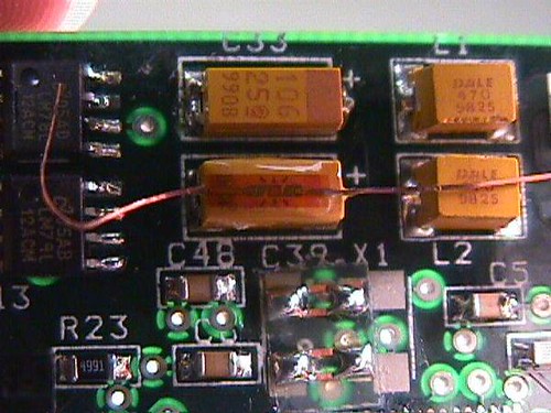 May 22, 2017 - 4:07am - In printed circuit board testing, sometimes it is desired to know the strain applied to a component as the board is flexed.  This photo shows a Micro-Measurements EA-XX-015DJ-120 strain gage trimmed and bonded to a surface mount capacitor.