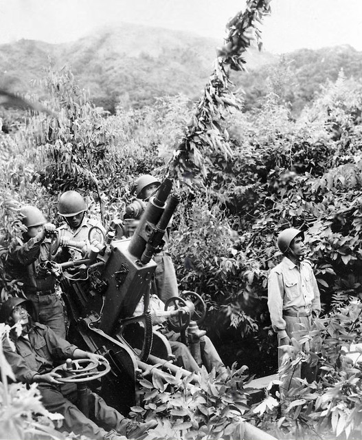 Laotian people's liberation army soldiers getting the anti aircraft gun ready during the U S and South Vietnam invasion of Laos