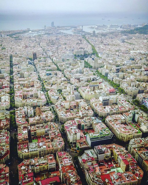 (#droneview) | The Eixample (Catalan pronunciation: [əˈʃampɫə], Catalan for 'expansion' or 'Expansion District') is a district of #Barcelona between the old city (Ciutat Vella) and what were once surrounding small towns (Sants, Gràcia, Sant Andreu etc.),