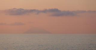 Distant Island At Sunset