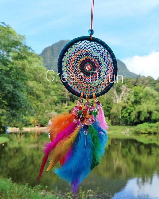 When colors meet the rainforest, a beautiful combination comes together. This multi-colored dreamcatcher is set in the foreground of Mount Santubong, at the Sarawak Cultural Village for the Rainforest World Music Festival 2017. #rwmf #rwmf2017 #sarawak #b