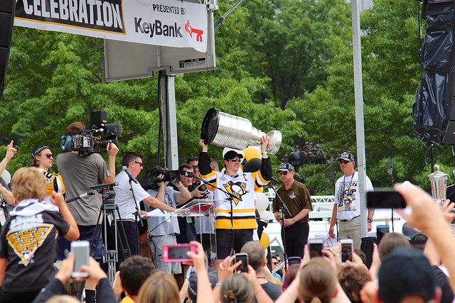 Sidney Crosby raising the cup at stage