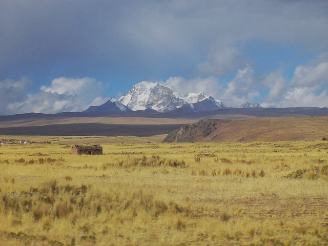 On the bus traveling from #Peru to #Bolivia, along the shore of #LakeTiticaca with views of these beautiful #SnowCapped #Mountains! #TreasuresOfTraveling #SouthAmerica. Read more about my crazy #BorderCrossing experience here: http://treasuresoftraveling.