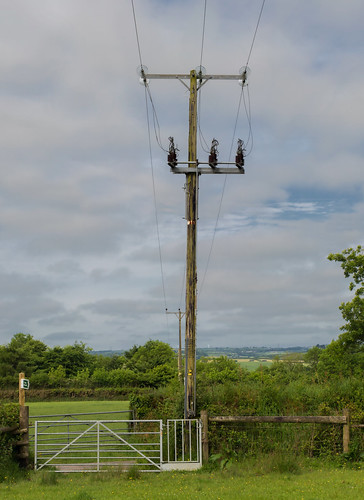 telegraphtuesday htt powerlines powerpole power electric fence gate field landscape clouds