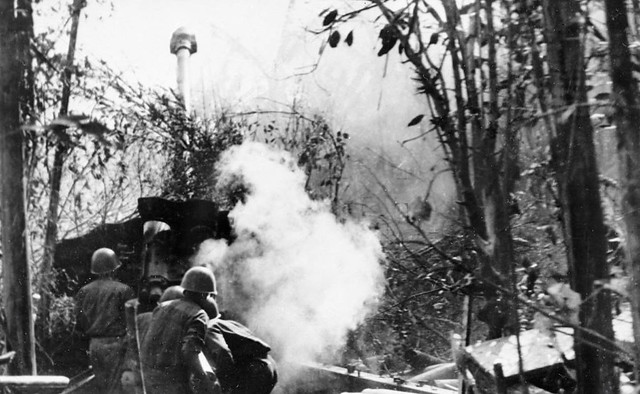 Laotian people's liberation army gunner delivering fire at the elevation 456 held by South Vietnamese troops
