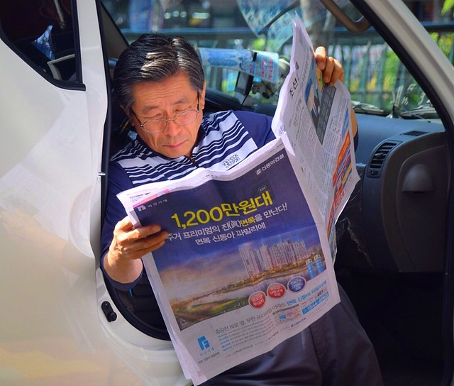 Driver Reading Newspaper