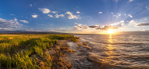 kyrgyzstan 2017 lakes water sunset sunrays sunshine sun clouds sky grass landscape scenery summer canon canon5dmarkii canonef1740mmf4l panorama panoramic hdr issykkul beautiful vacation green red yellow blue waves wind