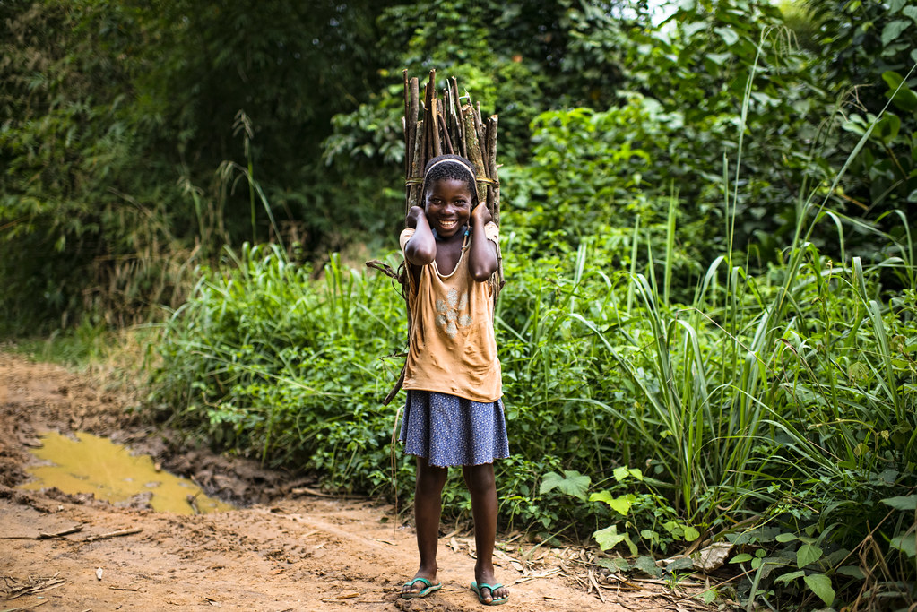 A child carries firewood while we were on the way from Kisangani to the village of Masako. Democratic Republic of...