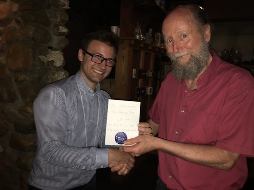 Professor Richard Sutton presents the award to Clement Gehring for being the first person to RSVP for our RLDM party