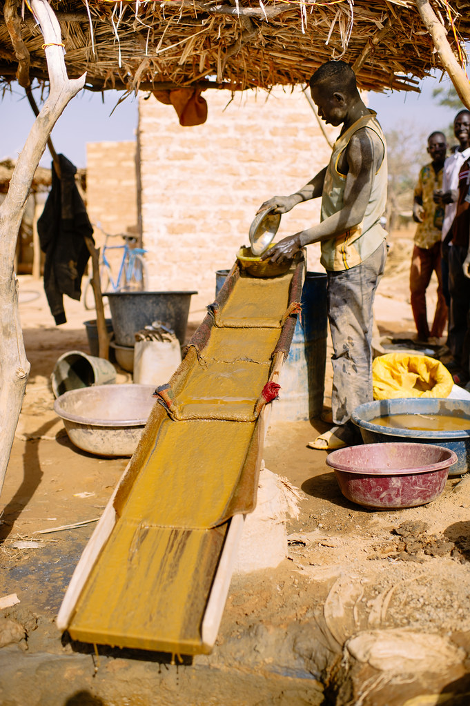Gold mine in Tamiougou just south of Kongoussi. Madi, 27 year olds, a gold prospector using a sluice box to...