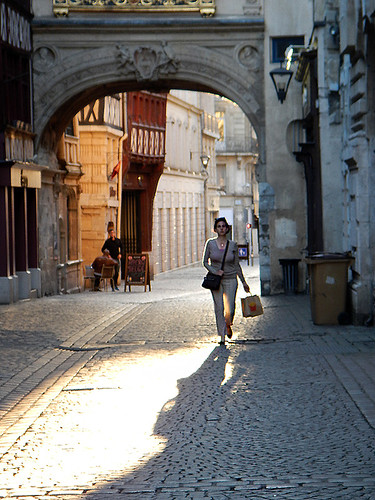 Sun-lit archway in the narrow streets of Rouen, France