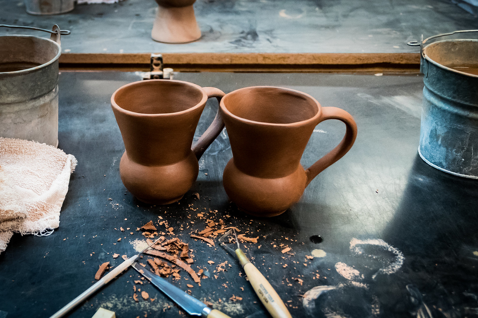 We smoothed and shaped these mugs ourselves! So fun!