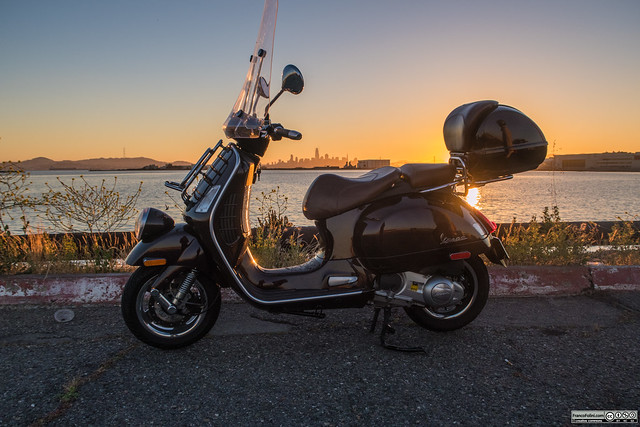 Vespa with a sunset over San Francisco