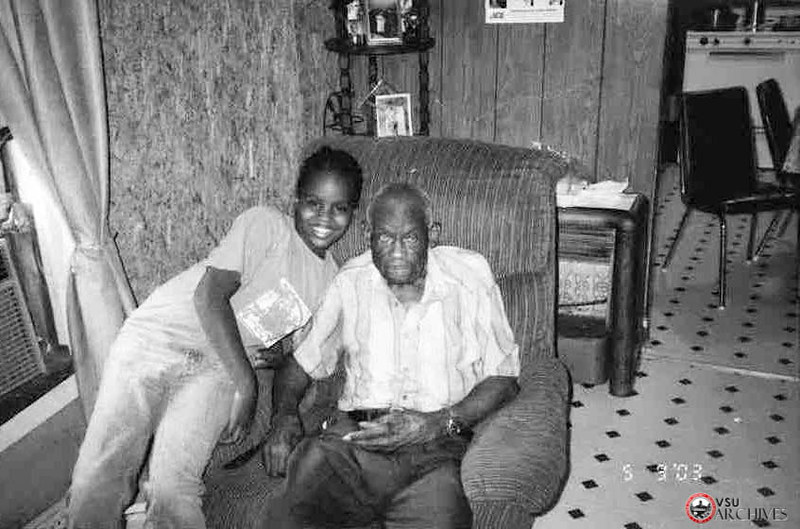 Stick Nelson with his granddaughter, photo by LeRoy Henderson, 2003. https://flic.kr/p/V6CZhb