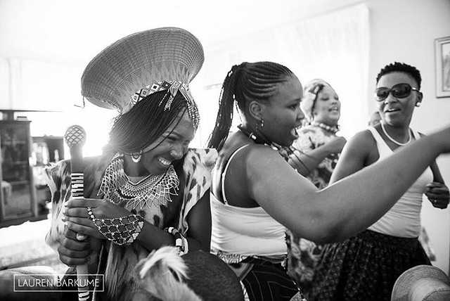 Sounds of joy surrounded Makhosi as she danced through the house.   Singing and laughter and the gentle clatter of beads.   It was a good day for a wedding.   #africaday #africanwedding #weddingphotographer #zuluwedding #dance #bw #love