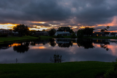 pond hunterscreek home sunset backyard reflection orlando florida