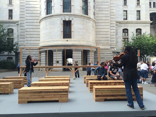 musicians playing inside the City Hall courtyard