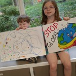 Younger Cedar Lane members holding up signs for the Climate March, 4.28.17