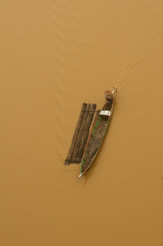 A boat is seen crossing through the mist on the Kahayan river, Palangka Raya, Central Kalimantan.
