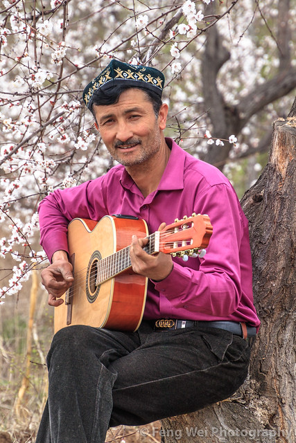 Uyghur Man Playing Guitar, Yining, Xinjiang China