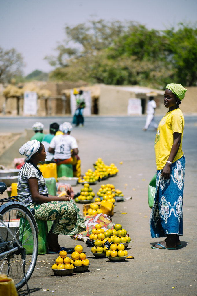 On the road between Ouagadougou and Manga, people Sell fruits and vegetables on the roadside. Burkina Faso.