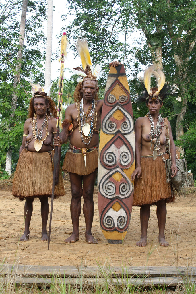 Papuans in their traditional clothes, Papua, Indonesia.