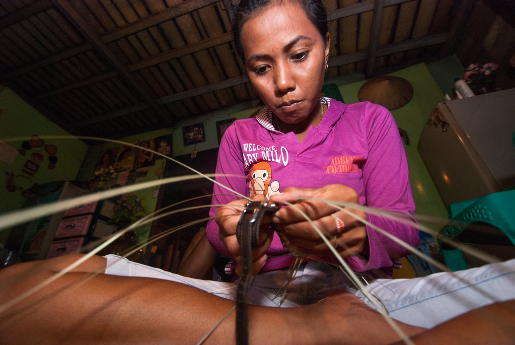 Yunita Kanca makes a bemban-based handicraft (Non-timber forest product). She and several other girls made a working group called Tujuh...