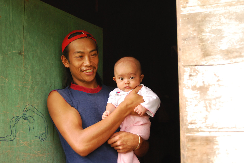 A father and his baby in Gunung Simpang, West Java, Indonesia.