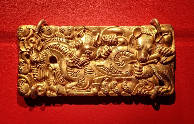 Gold belt buckle depicting a hunting scene, probably an imperial gift to a Chu king, from a Western Han Dynasty tomb Tianqi Mountain Xuzhou Jiangsu China 2nd century BCE