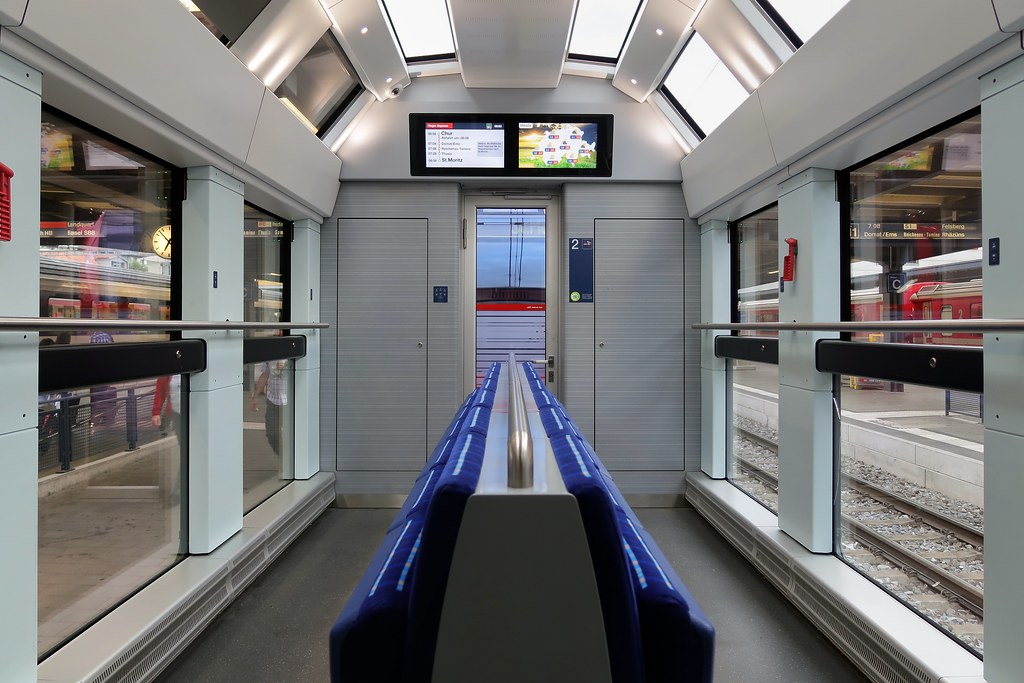 Interior of a railway carriage with windows and seating