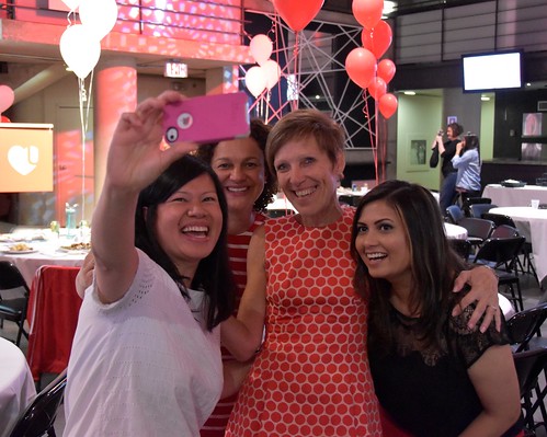 Lucy takes a selfie with staff members from the Division of Students