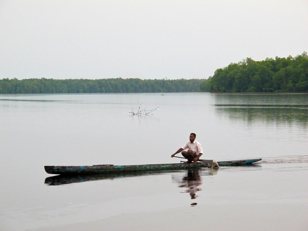 Local villager canoeing. Yoke Village, Mamberamo Raya, Papua.