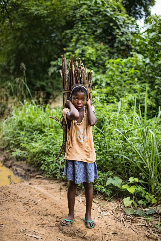 A child carries firewood while we were on the way from Kisangani to the village of Masako. Democratic Republic of...