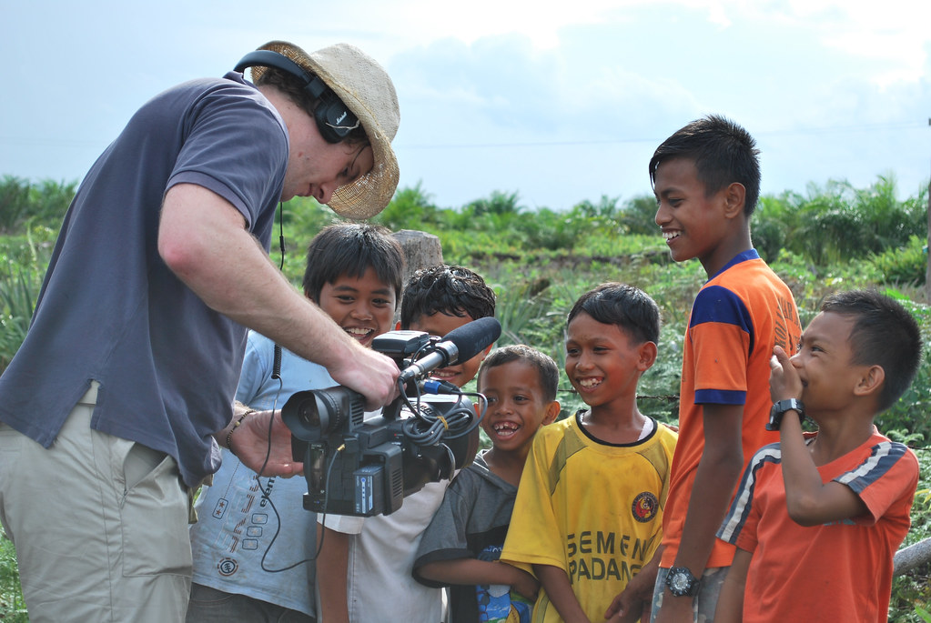 Filming children in Jambi, Sumatra, Indonesia.