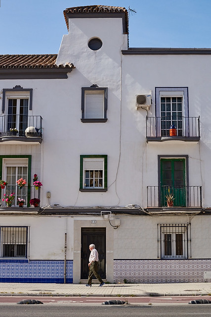 Old man walking in the street, Huelin barrio, Malaga, Spain
