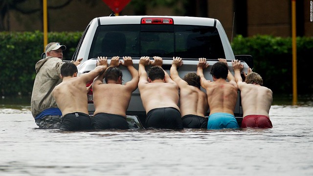 Men pushing truck in Houston