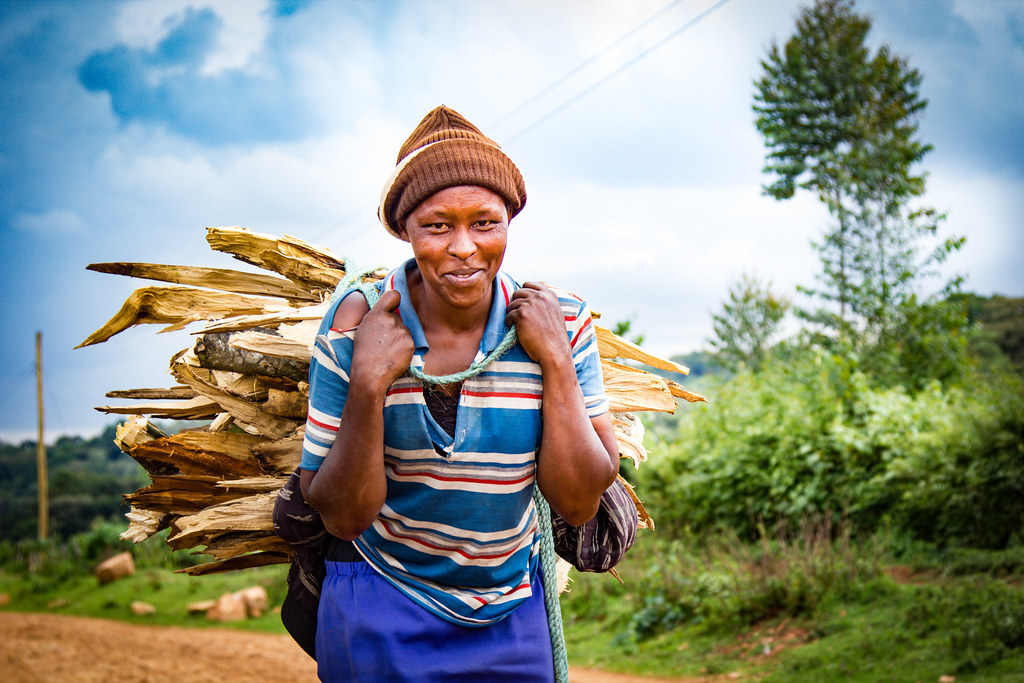 A woman carrying firewood. Photo by Sande Murunga/CIFOR cifor.org forestsnews.cifor.org...
