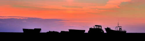 evening orange silhouette clouds boats tractors machinery cley beach norfolk nature nikon angela wilson