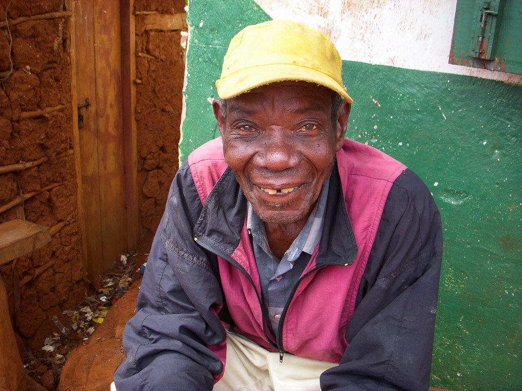 A man sitting in Mbango, Tanzania.