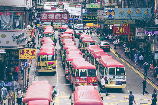 Red Minibuses lining up, waiting for passengers at a busy station in Mongkok, Hong Kong