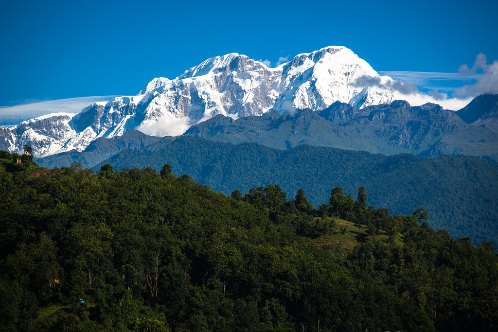 One of the tops of the Himalayas is visible from the village of Nalma, Lamjung, Nepal.