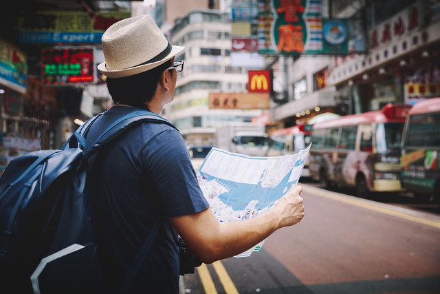 Male tourist with map