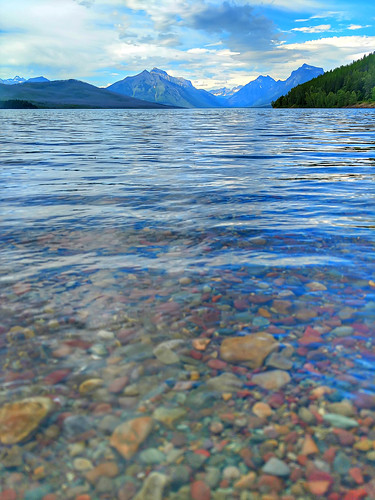 view lake montana mcdonald green blue horizontal sky day reflection travel park outdoors scene nature fresh environment water autumn mountain landscape tranquil calm trees snow clear mountains scenery clouds usa rock scenic tourism wild north glacier peak woods national coniferous stones america format flathead county
