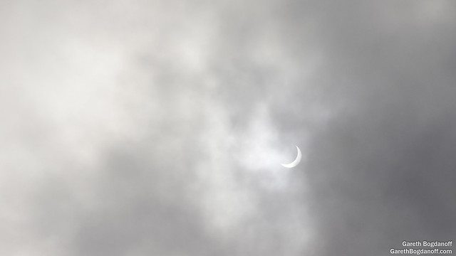Solar Eclipse Through the Clouds