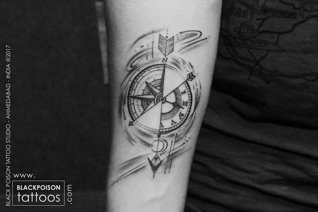 Compass with arrow tattoo