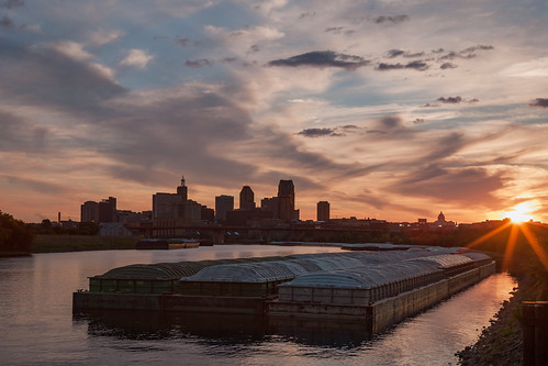 sunset stpaul mississippiriver barges downtown